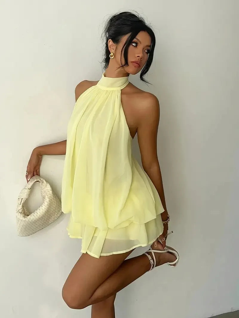 Abito da donna con collo all’americana, minigonna in chiffon senza schienale