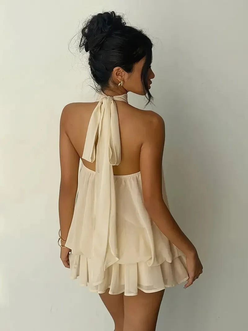 Abito da donna con collo all’americana, minigonna in chiffon senza schienale