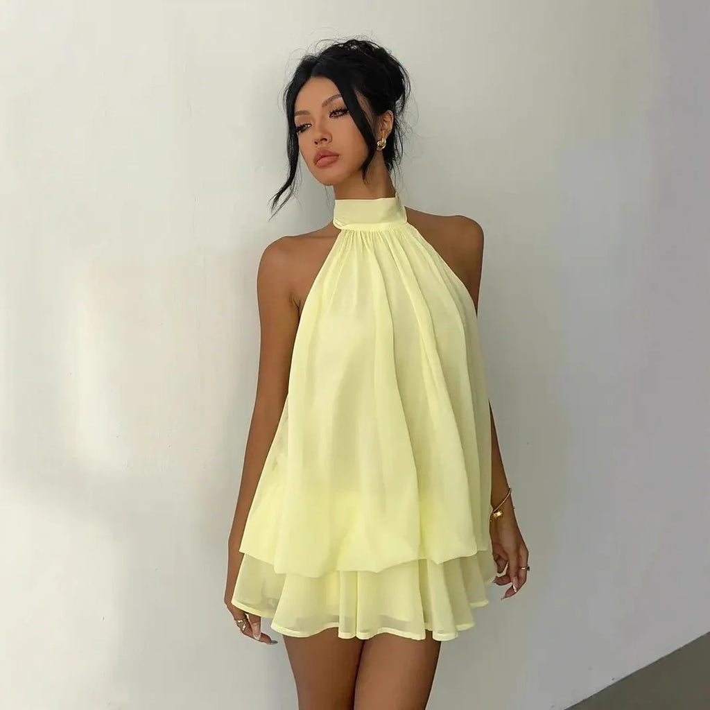 Abito da donna con collo all’americana, minigonna in chiffon senza schienale