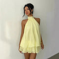 Abito da donna con collo all’americana, minigonna in chiffon senza schienale