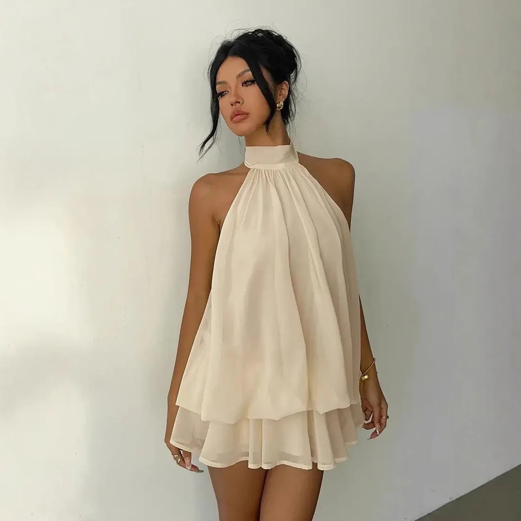 Abito da donna con collo all’americana, minigonna in chiffon senza schienale