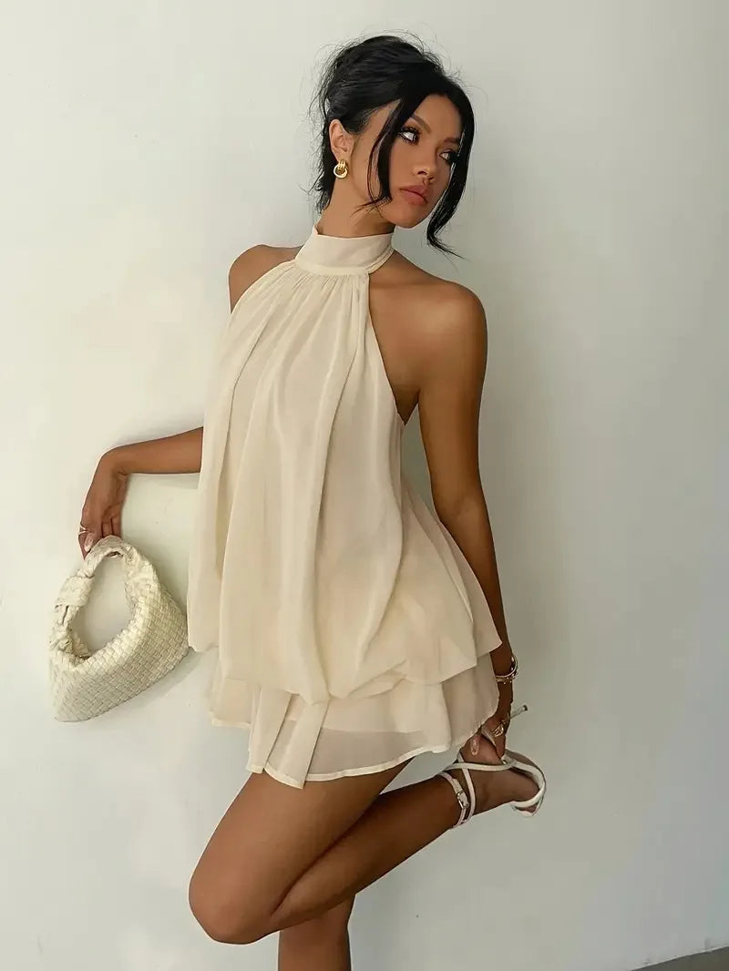 Abito da donna con collo all’americana, minigonna in chiffon senza schienale